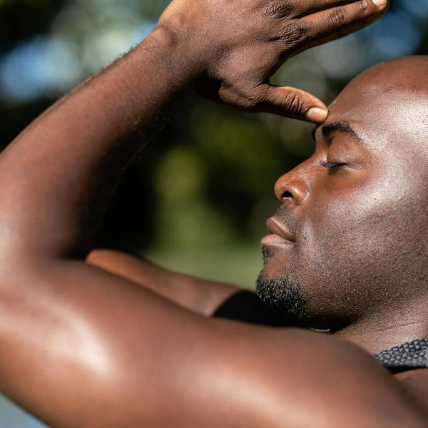 Athlete focusing on his breathing during a slow repetition exercise in a calm environment.